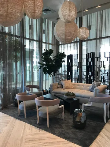 a outdoor space with patio couch and a potted plant