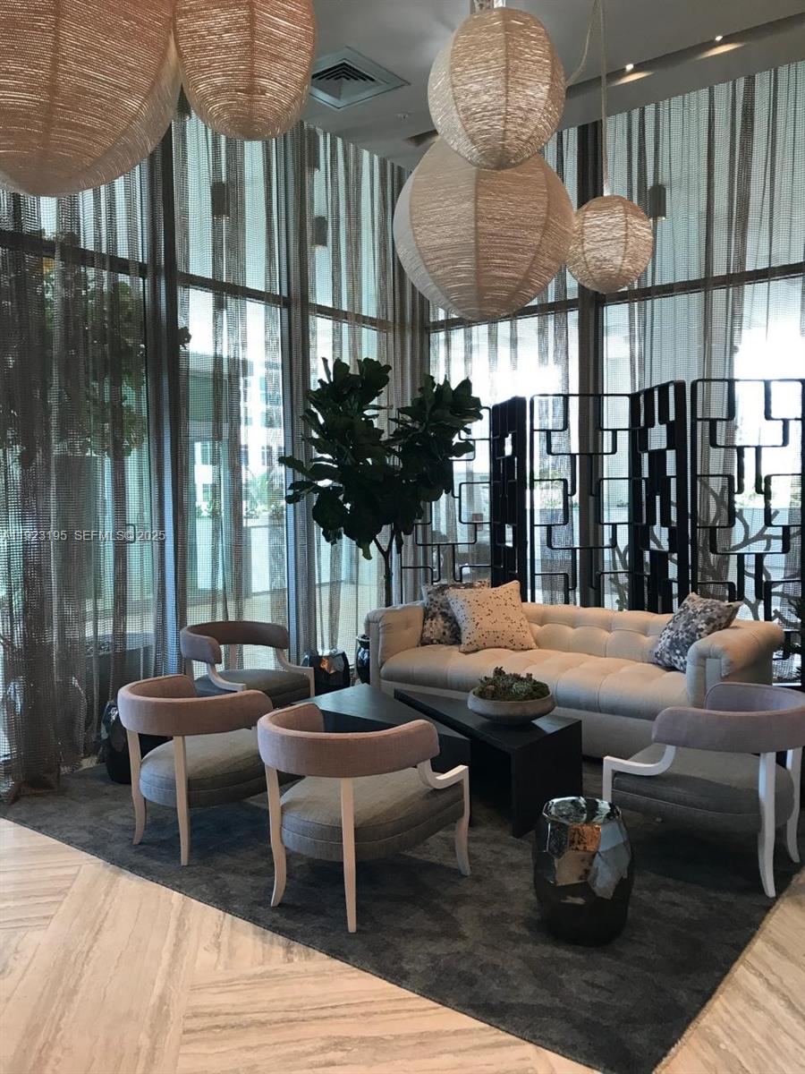 2900 Northeast 7th Avenue, Unit 3203 Miami, FL 33137 - Photo 8 of 8 a outdoor space with patio couch and a potted plant