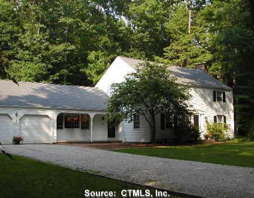 18 Sunset Hill Road Simsbury, CT 06070 - Photo 1 of 1 a front view of a house with a yard and an trees