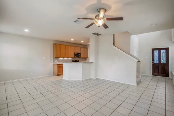 a view of a kitchen with a sink and cabinets