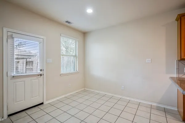 a view of an empty room and window