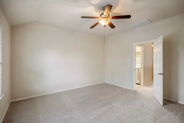 a bathroom with a tub a sink and mirror