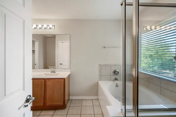 a bathroom with 2 sink and a mirror