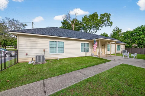 an empty room with wooden floor and a window