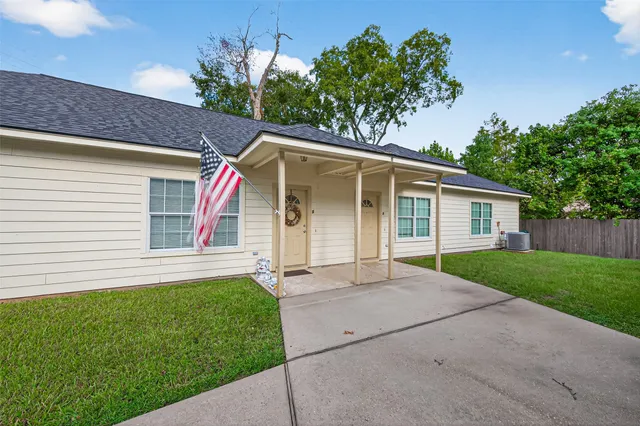 a bathroom with a granite countertop sink toilet and bathtub