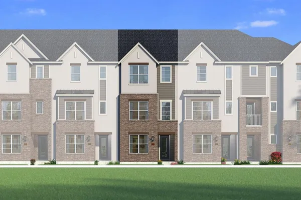 a view of a white house with a big yard and large trees