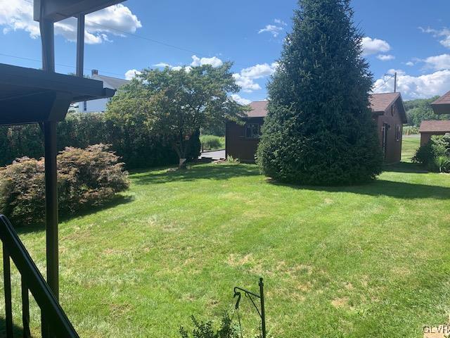 2423 Crest Street Coplay, PA 18037 - Photo 17 of 21 a view of a backyard with couches plants and large tree