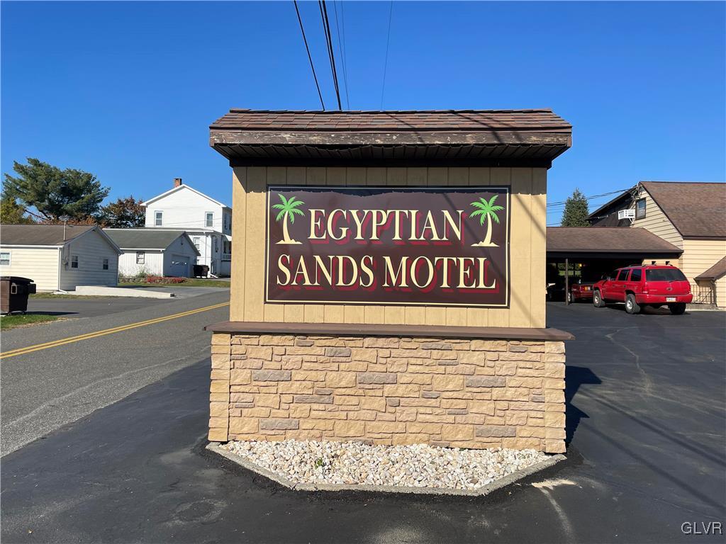 2423 Crest Street Coplay, PA 18037 - Photo 2 of 21 a view of outdoor space with signage and flags