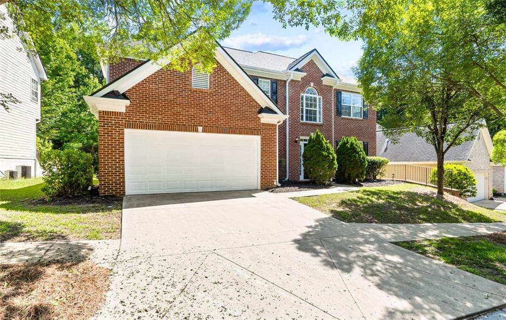 473 Greyhawk Way Fairburn, GA 30213 - Photo 34 of 34 a front view of a house with a yard and garage