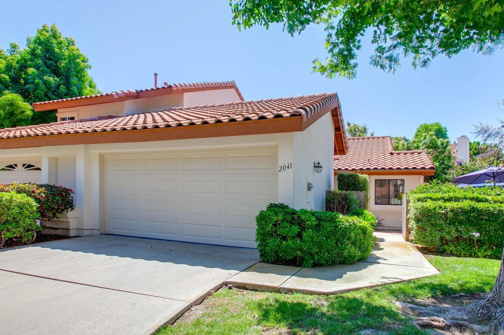 2041 Coolngreen Lane Encinitas, CA 92024 - Photo 1 of 36 front view of a house with a small yard