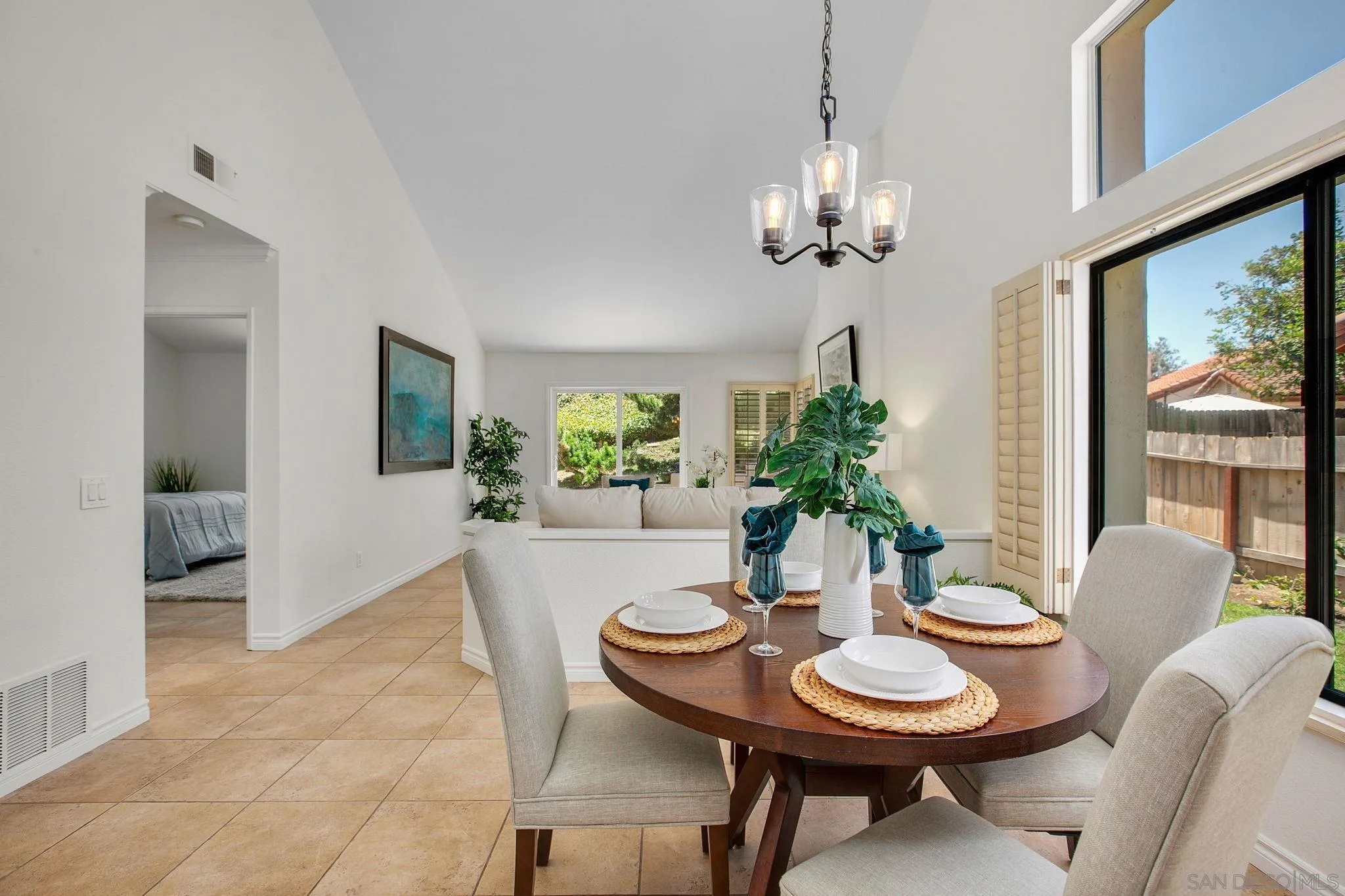 2041 Coolngreen Lane Encinitas, CA 92024 - Photo 13 of 36 a view of a dining room with furniture window and wooden floor