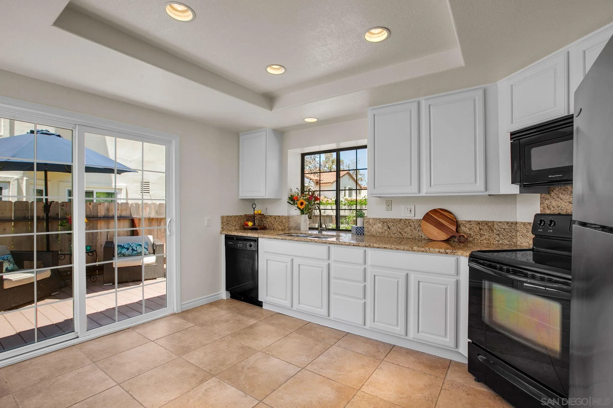 2041 Coolngreen Lane Encinitas, CA 92024 - Photo 15 of 36 a kitchen with stainless steel appliances granite countertop a stove sink and cabinets