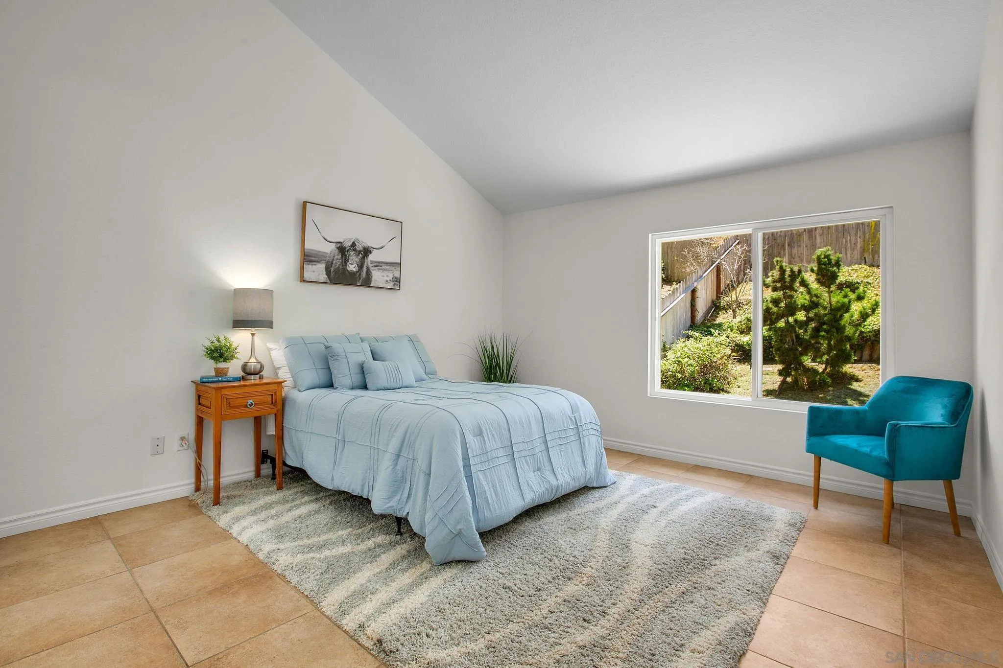 2041 Coolngreen Lane Encinitas, CA 92024 - Photo 19 of 36 a spacious bedroom with a bed and a window