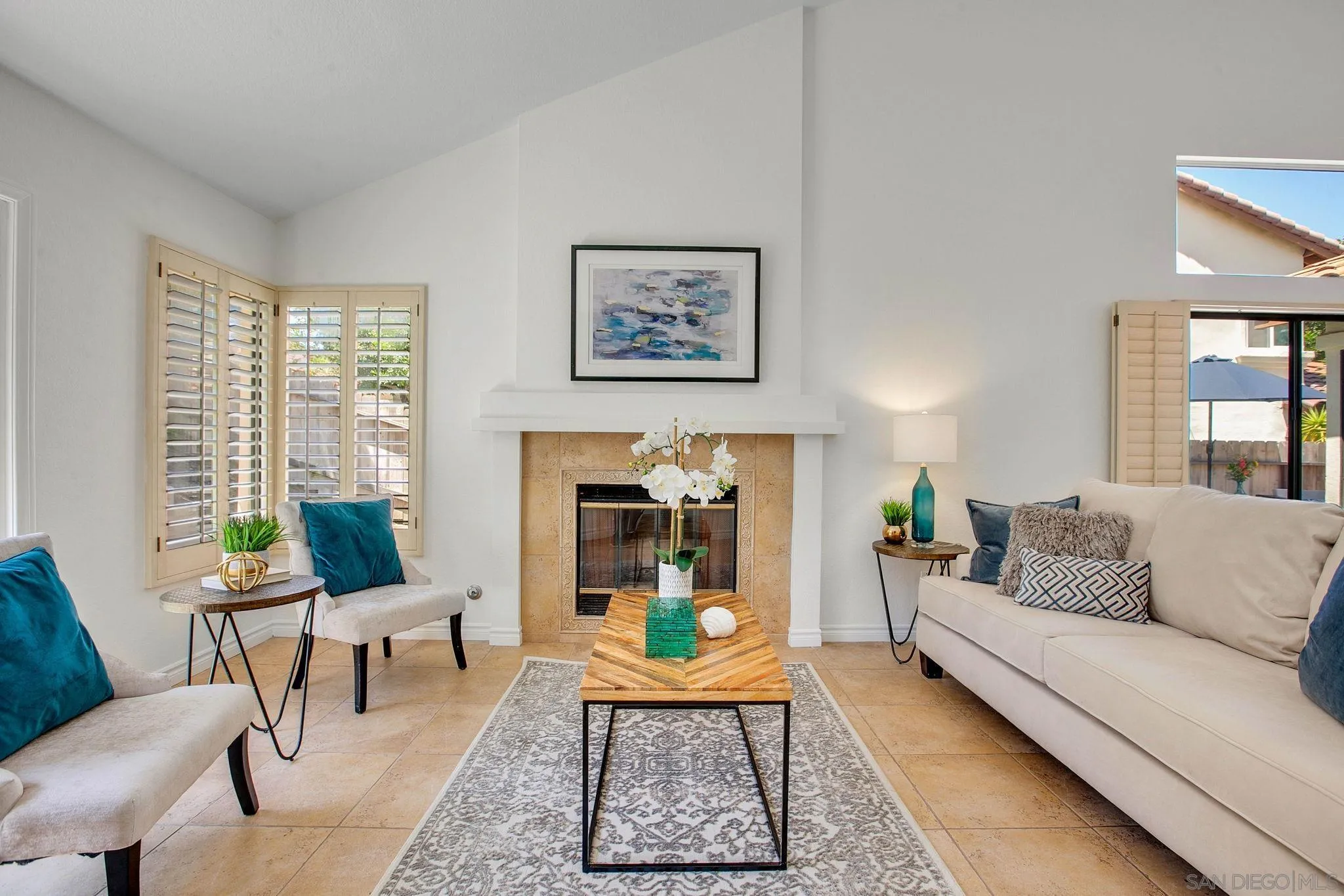 2041 Coolngreen Lane Encinitas, CA 92024 - Photo 4 of 36 a living room with furniture and a fireplace