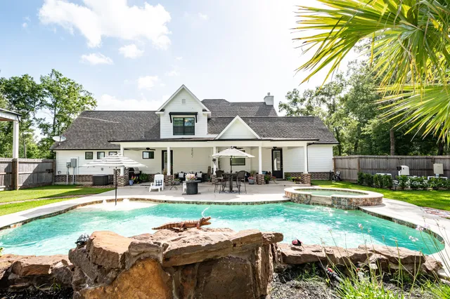 a front view of a house with garden and porch