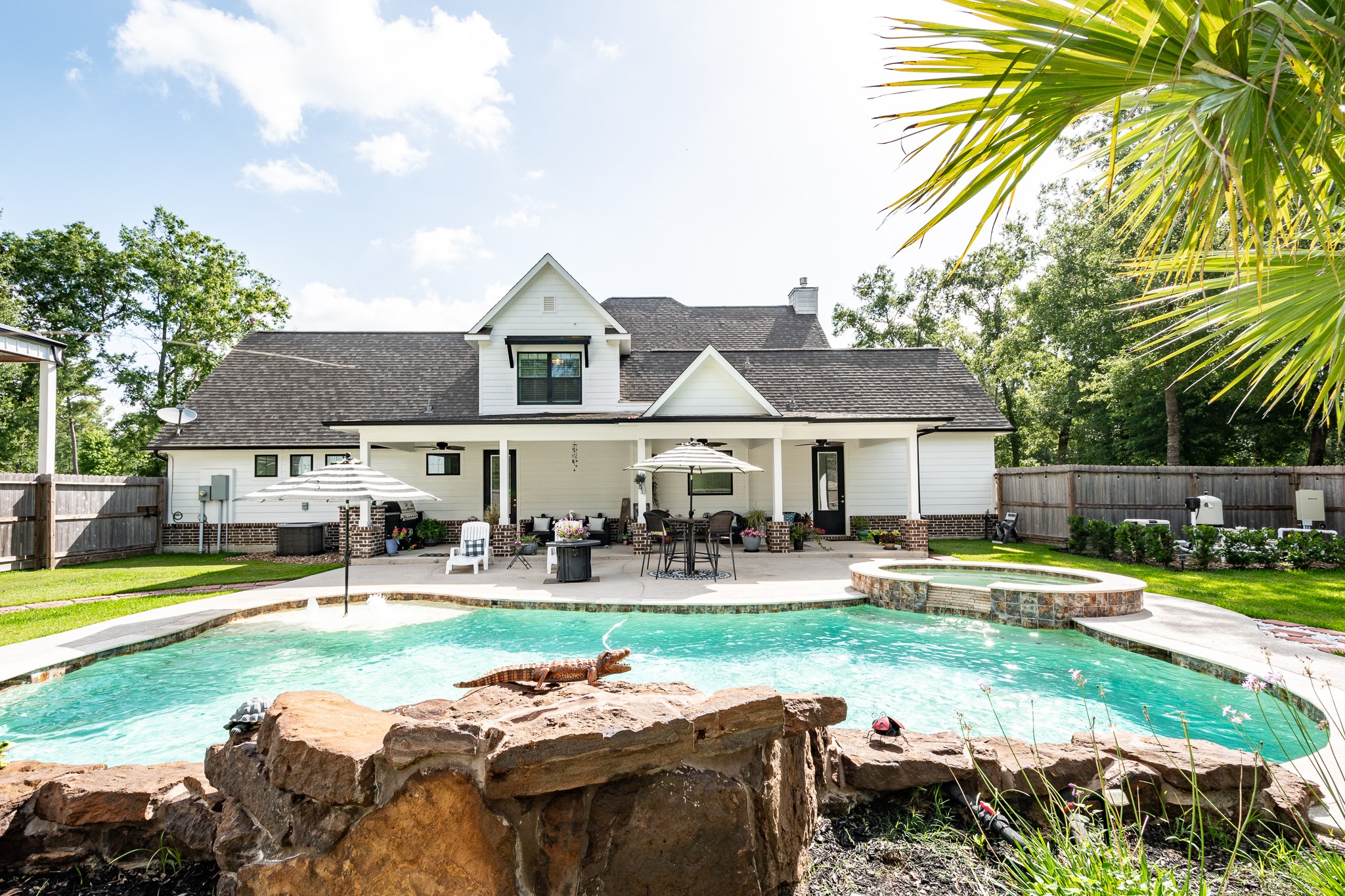 a front view of a house with garden and porch