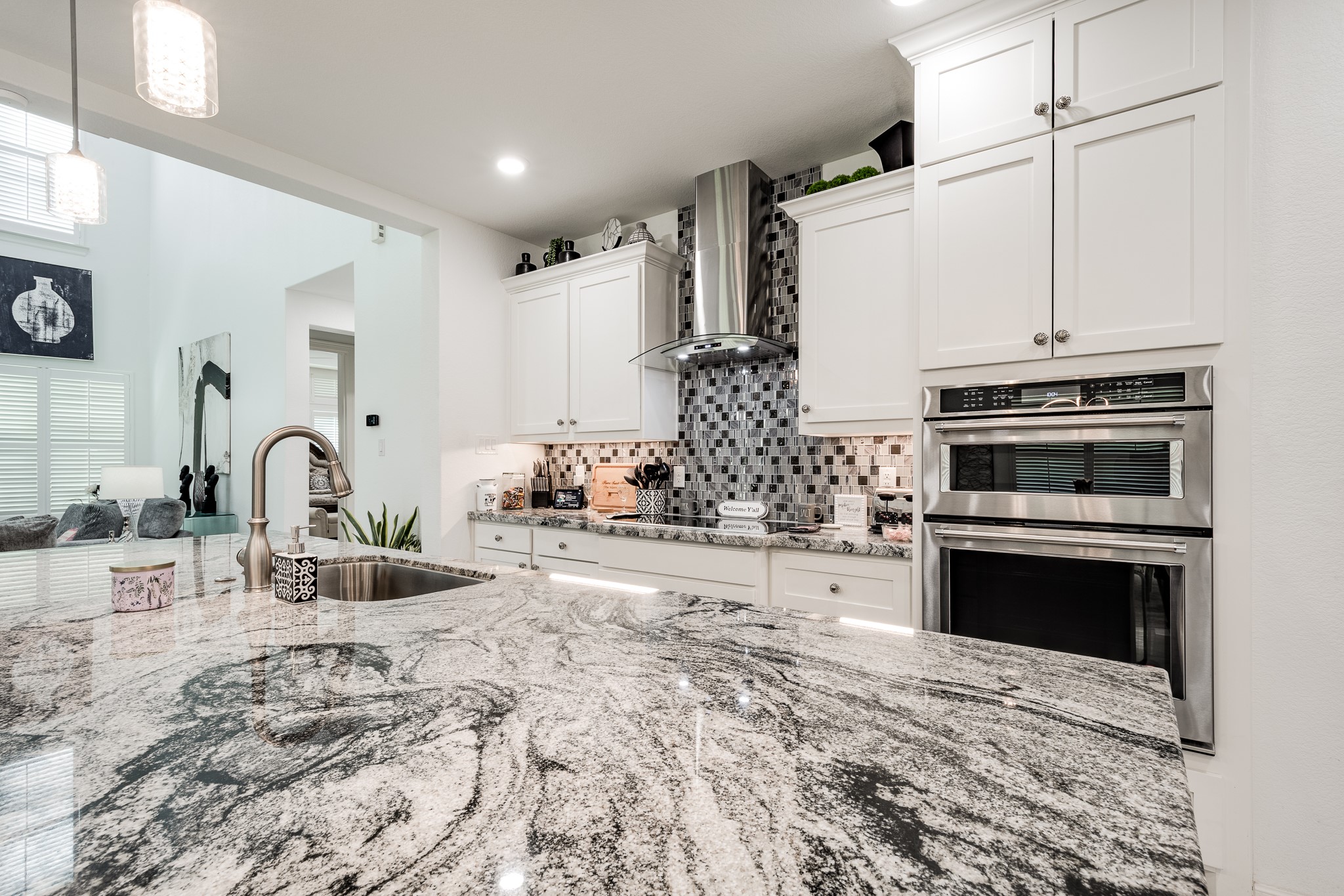 59 County Road Dayton, TX 77535 - Photo 20 of 50 a kitchen with stainless steel appliances kitchen island granite countertop a stove and a sink