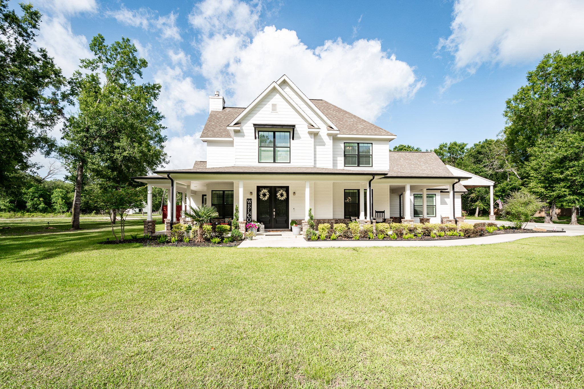 59 County Road Dayton, TX 77535 - Photo 2 of 50 a front view of a house with swimming pool having outdoor seating
