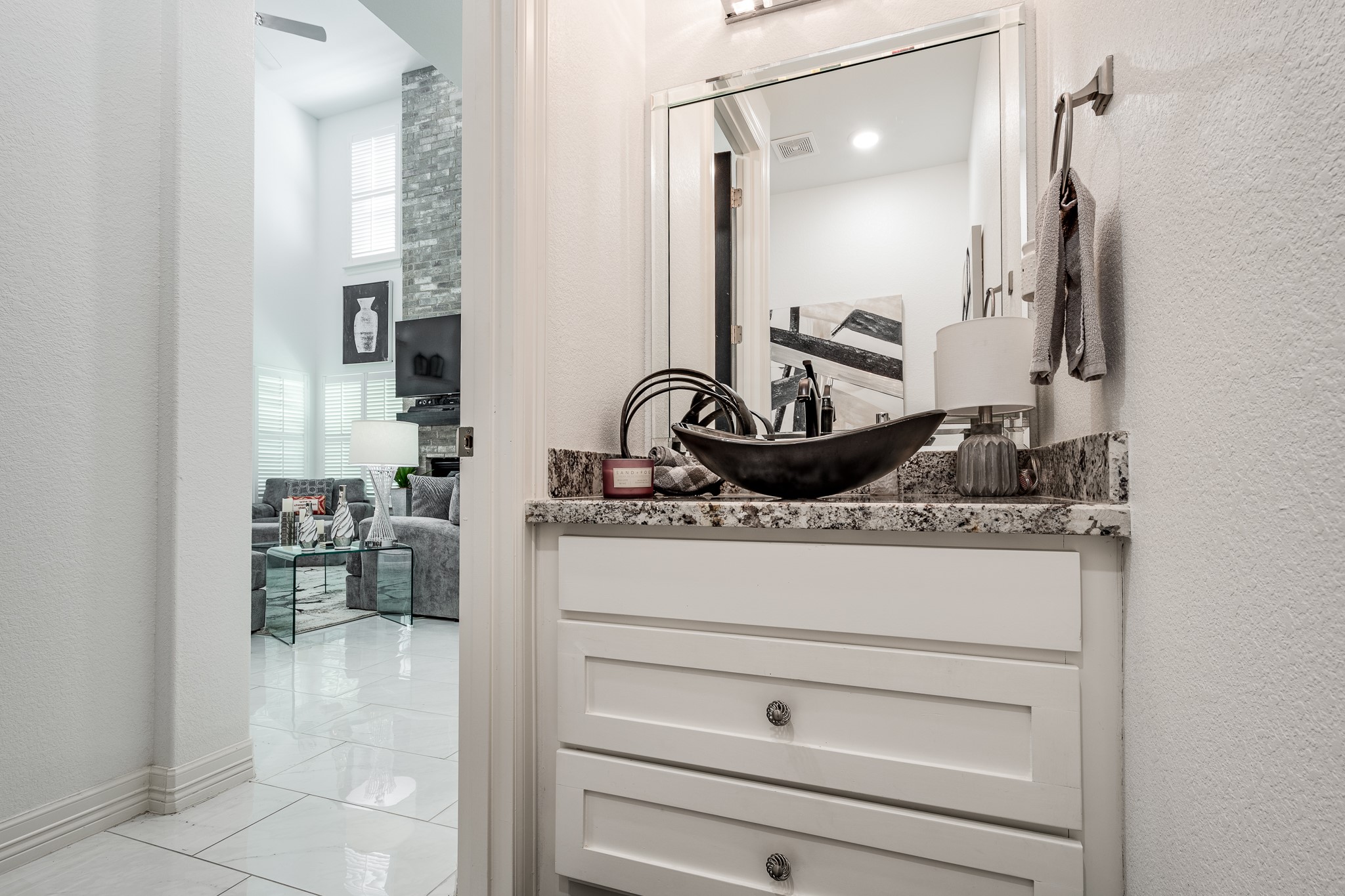 59 County Road Dayton, TX 77535 - Photo 28 of 50 a bathroom with a granite countertop sink a mirror and shower