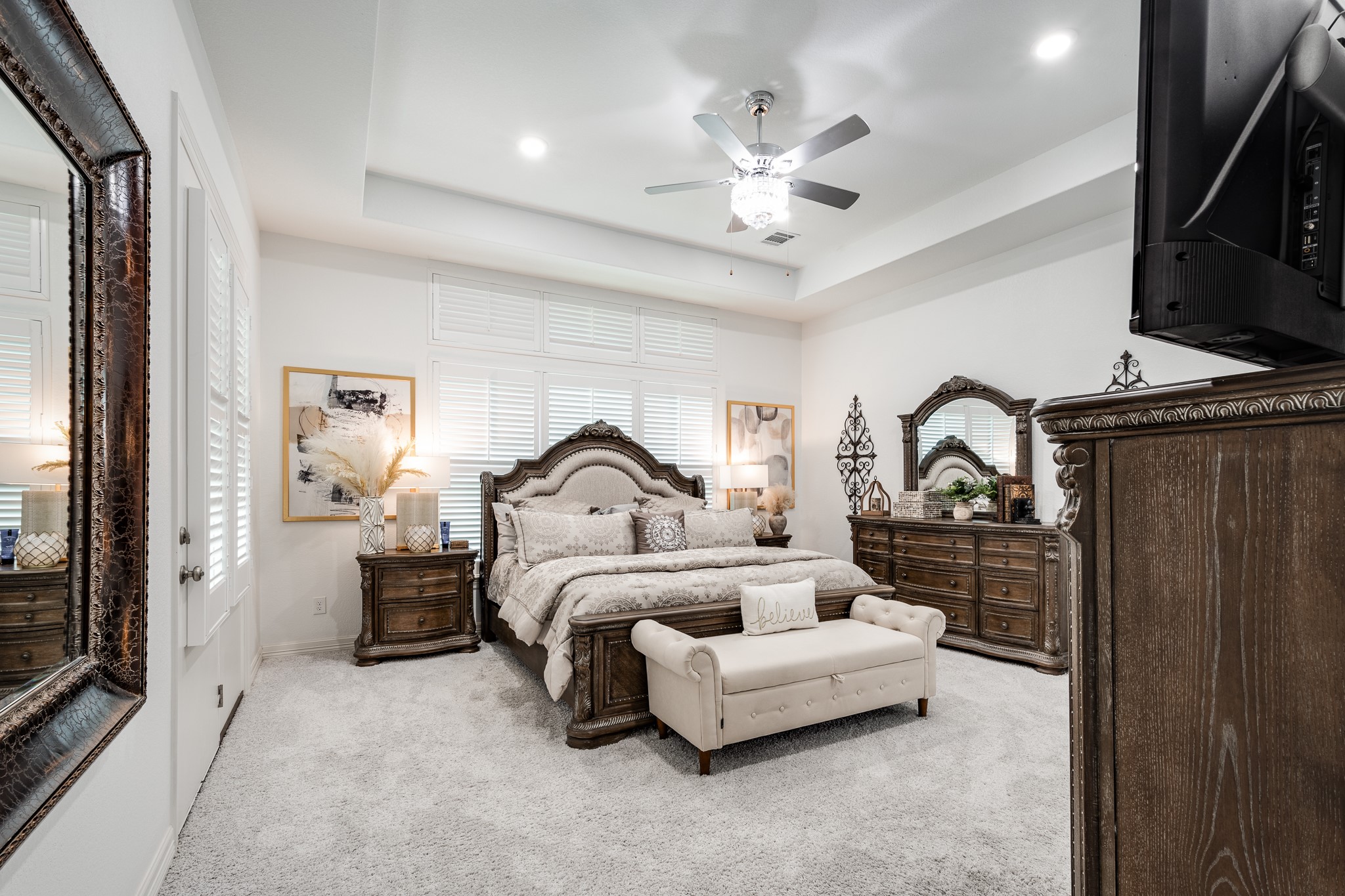 59 County Road Dayton, TX 77535 - Photo 29 of 50 a bedroom with bed and a chandelier