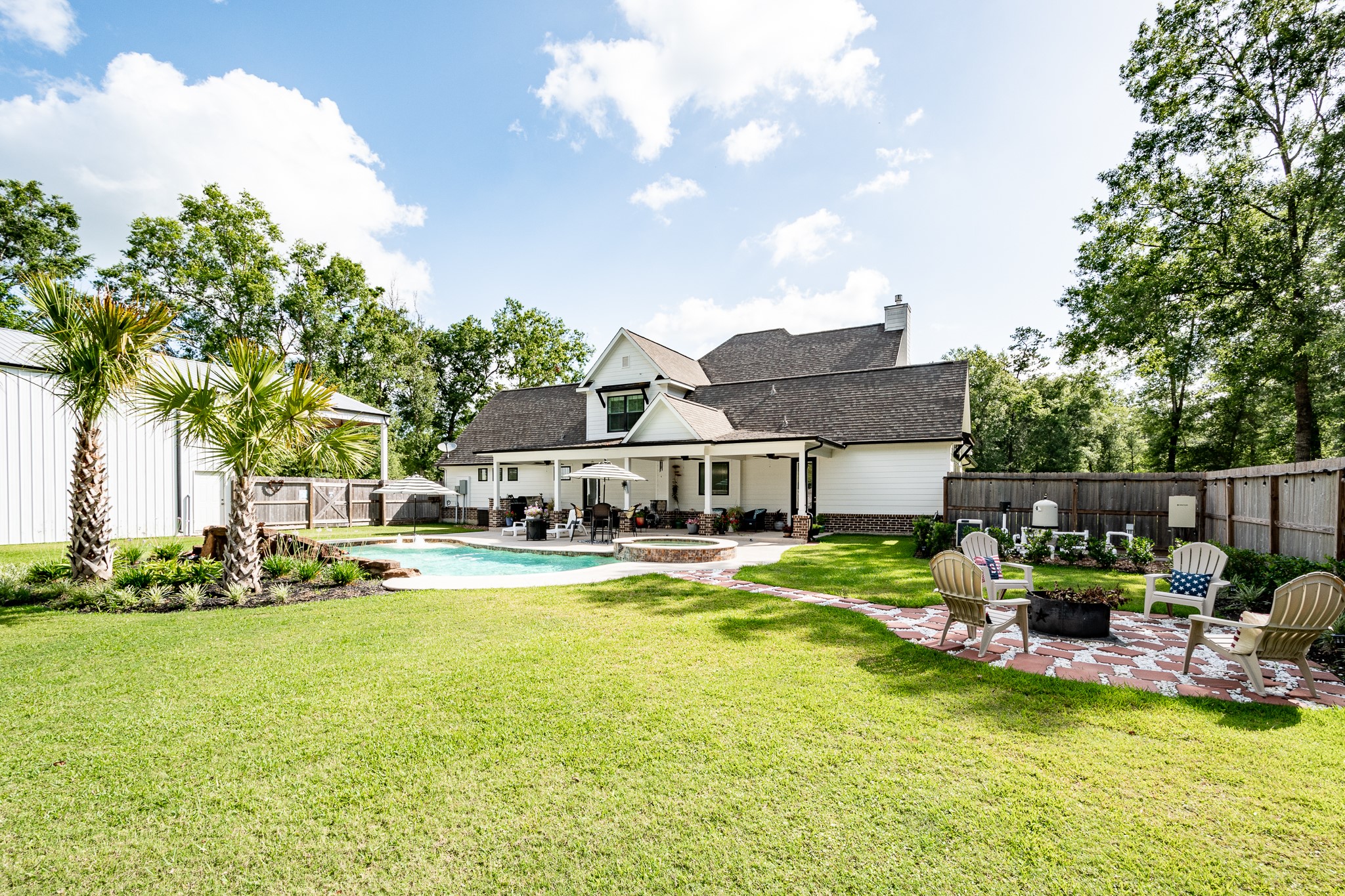 59 County Road Dayton, TX 77535 - Photo 3 of 50 a view of a house with swimming pool and sitting area