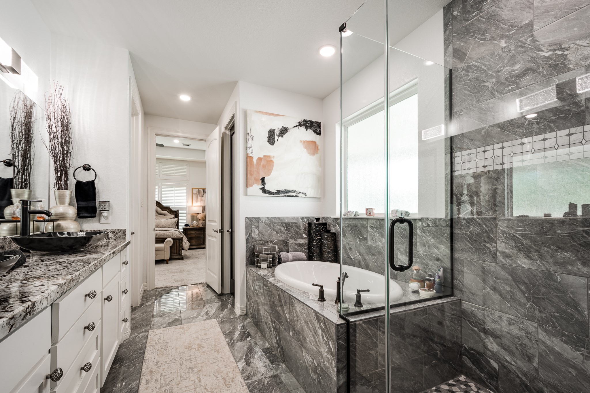 59 County Road Dayton, TX 77535 - Photo 32 of 50 a bathroom with a granite countertop tub sink a mirror and shower
