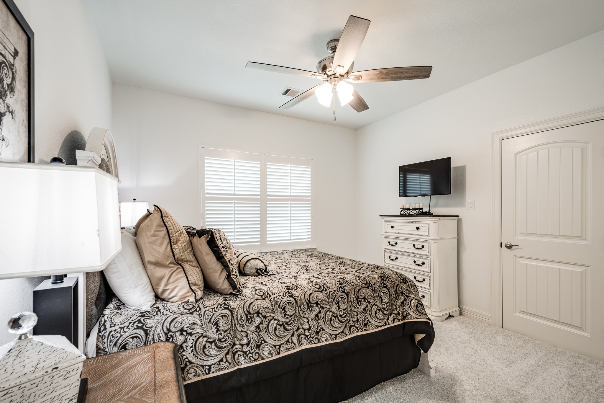 59 County Road Dayton, TX 77535 - Photo 35 of 50 a bedroom with a bed a window and a flat screen television