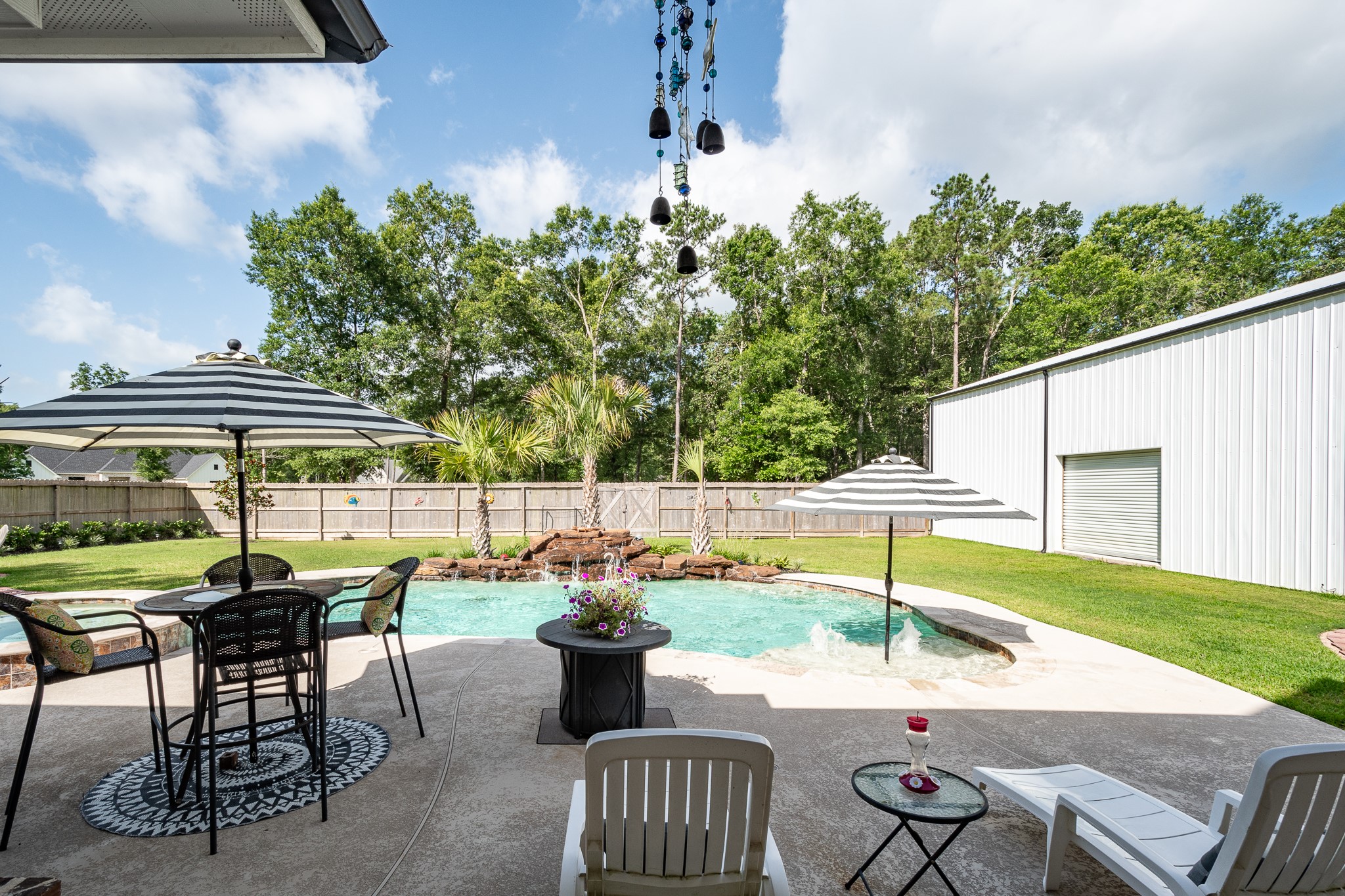 59 County Road Dayton, TX 77535 - Photo 38 of 50 a view of a patio with table and chairs and potted plants