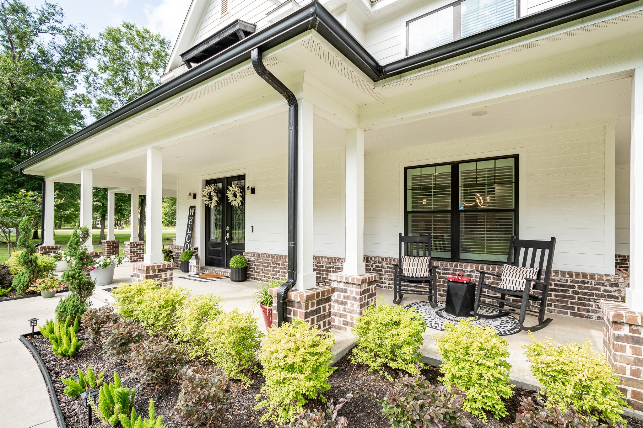 59 County Road Dayton, TX 77535 - Photo 4 of 50 a view of a patio with table and chairs potted plants and floor to ceiling window