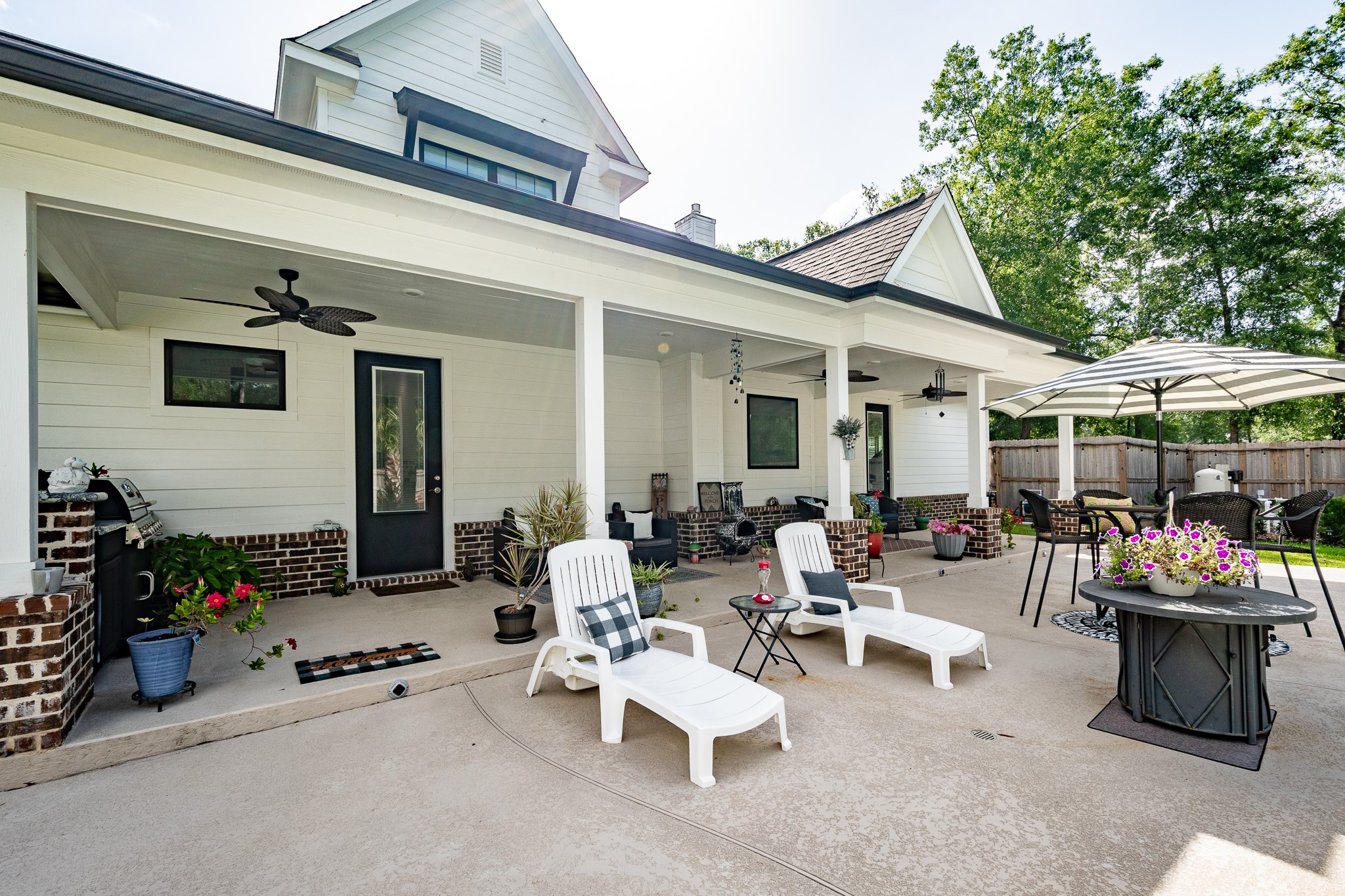 59 County Road Dayton, TX 77535 - Photo 44 of 50 a building outdoor space with patio furniture and potted plants
