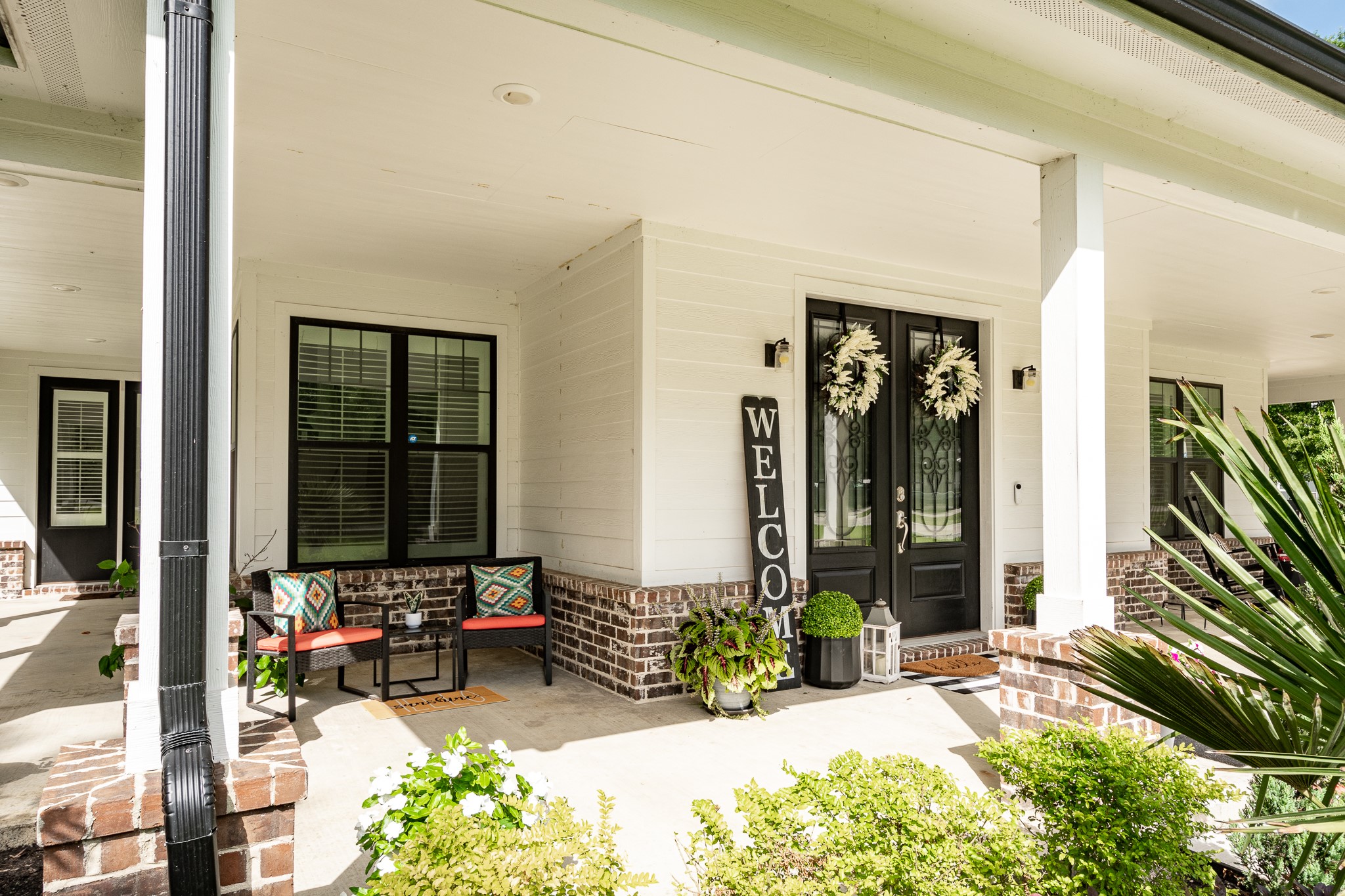 59 County Road Dayton, TX 77535 - Photo 5 of 50 a view of front door of house with outdoor seating