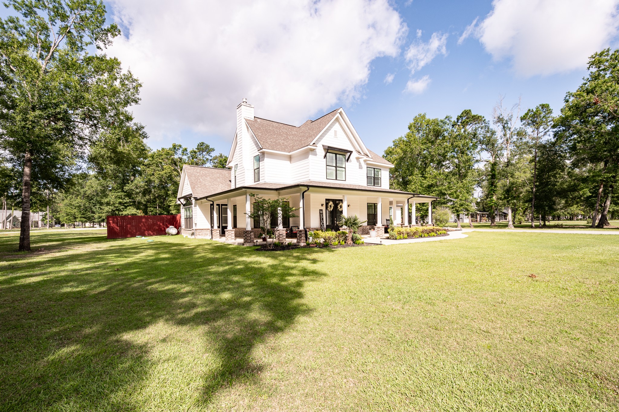 59 County Road Dayton, TX 77535 - Photo 8 of 50 a front view of a house with swimming pool having outdoor seating