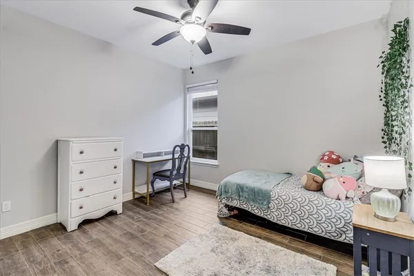 a bedroom with a bed and a table