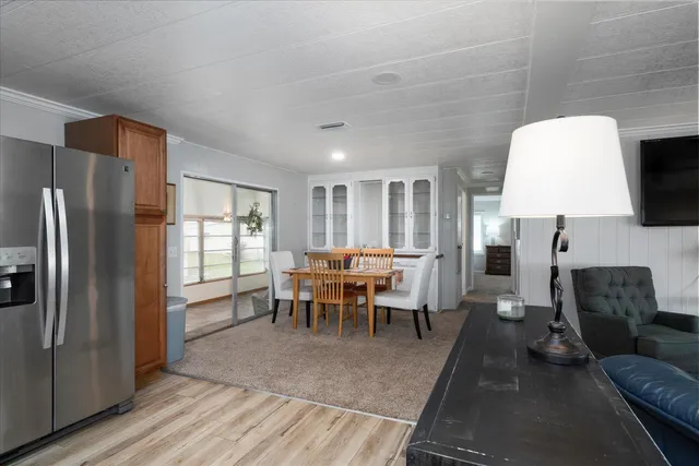 a living room with furniture a lamp and a table