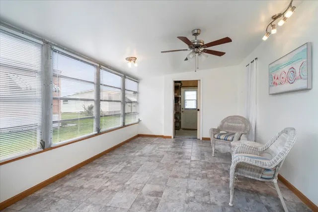 a view of workspace with furniture and windows