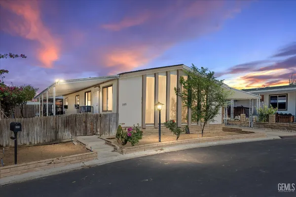 a front view of a house with a street