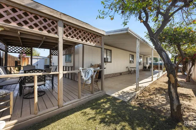 a view of a chairs and table in the patio