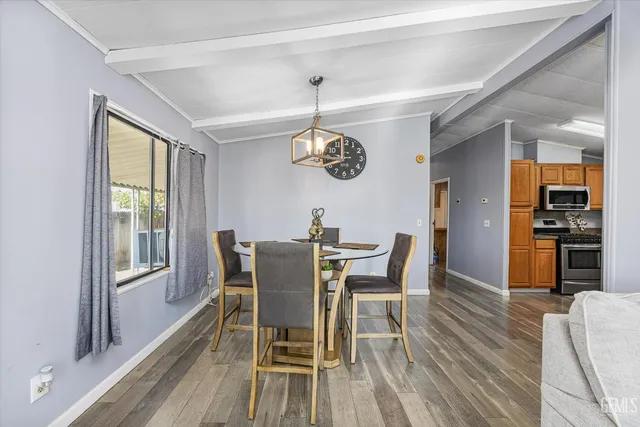 a dining room with furniture window wooden floor