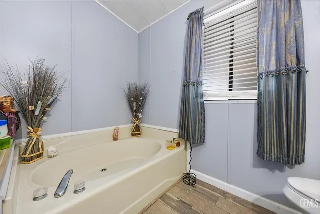 a bathroom with a tub and a sink
