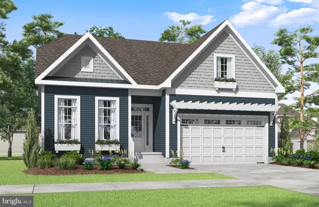 a view of a house with yard and plants
