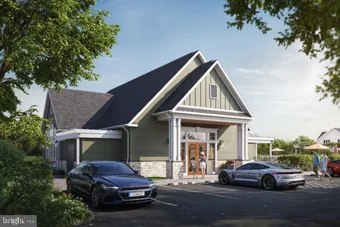 a front view of a house with car parked