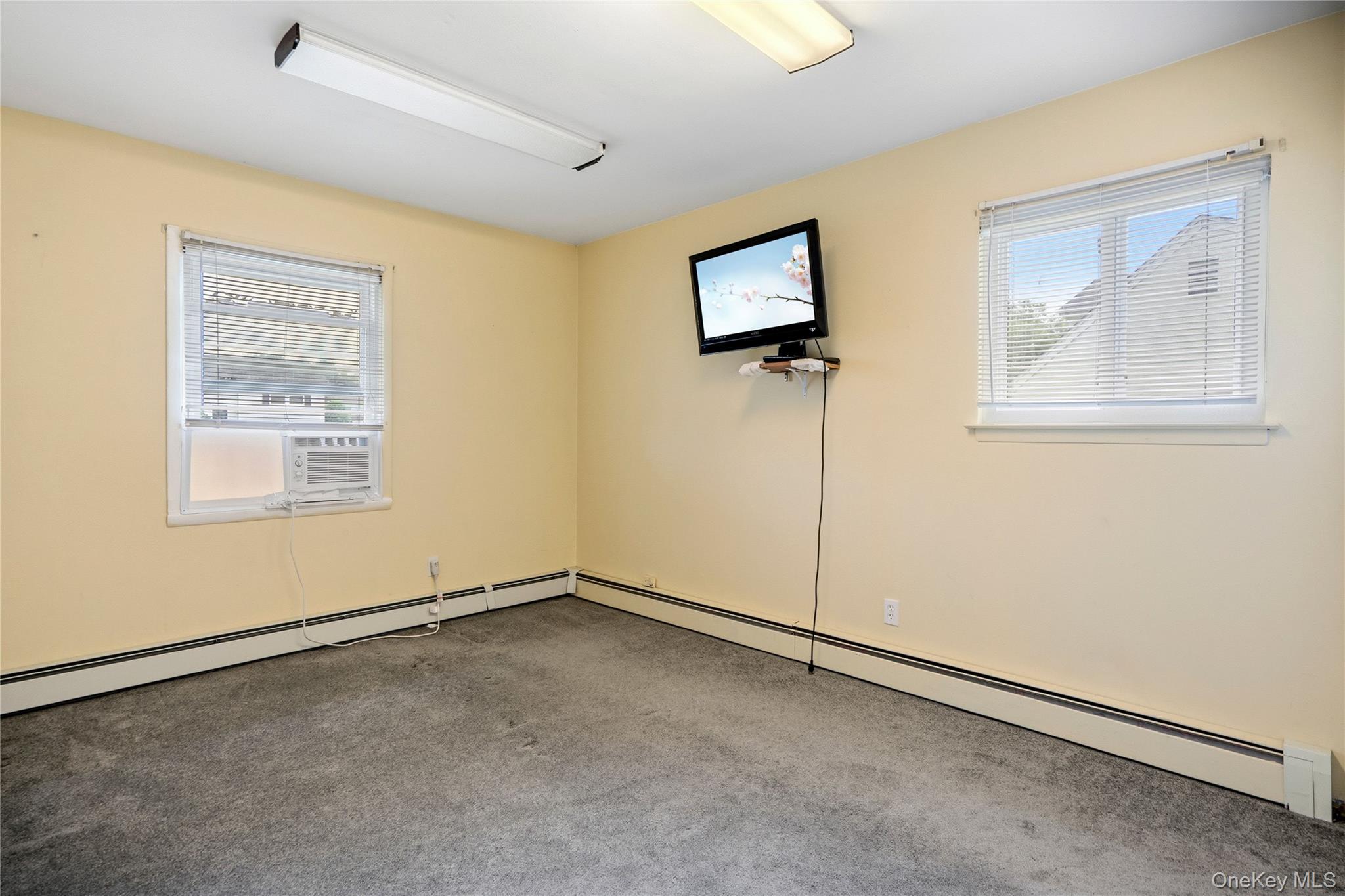 86 Cirrus Road Holbrook, NY 11741 - Photo 11 of 19 a view of an empty room with a window