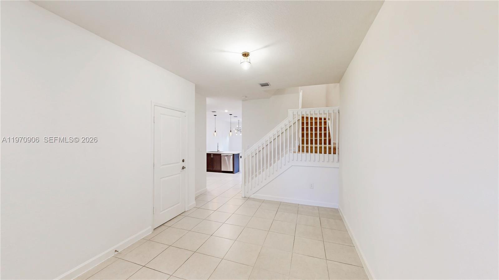 13158 Southwest 233rd Street Homestead, FL 33032 - Photo 19 of 72 a view of a hallway with staircase