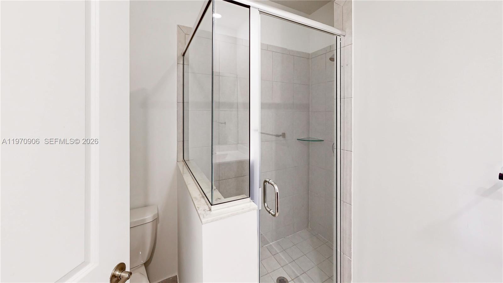 13158 Southwest 233rd Street Homestead, FL 33032 - Photo 26 of 72 a bathroom with a granite countertop shower and a mirror