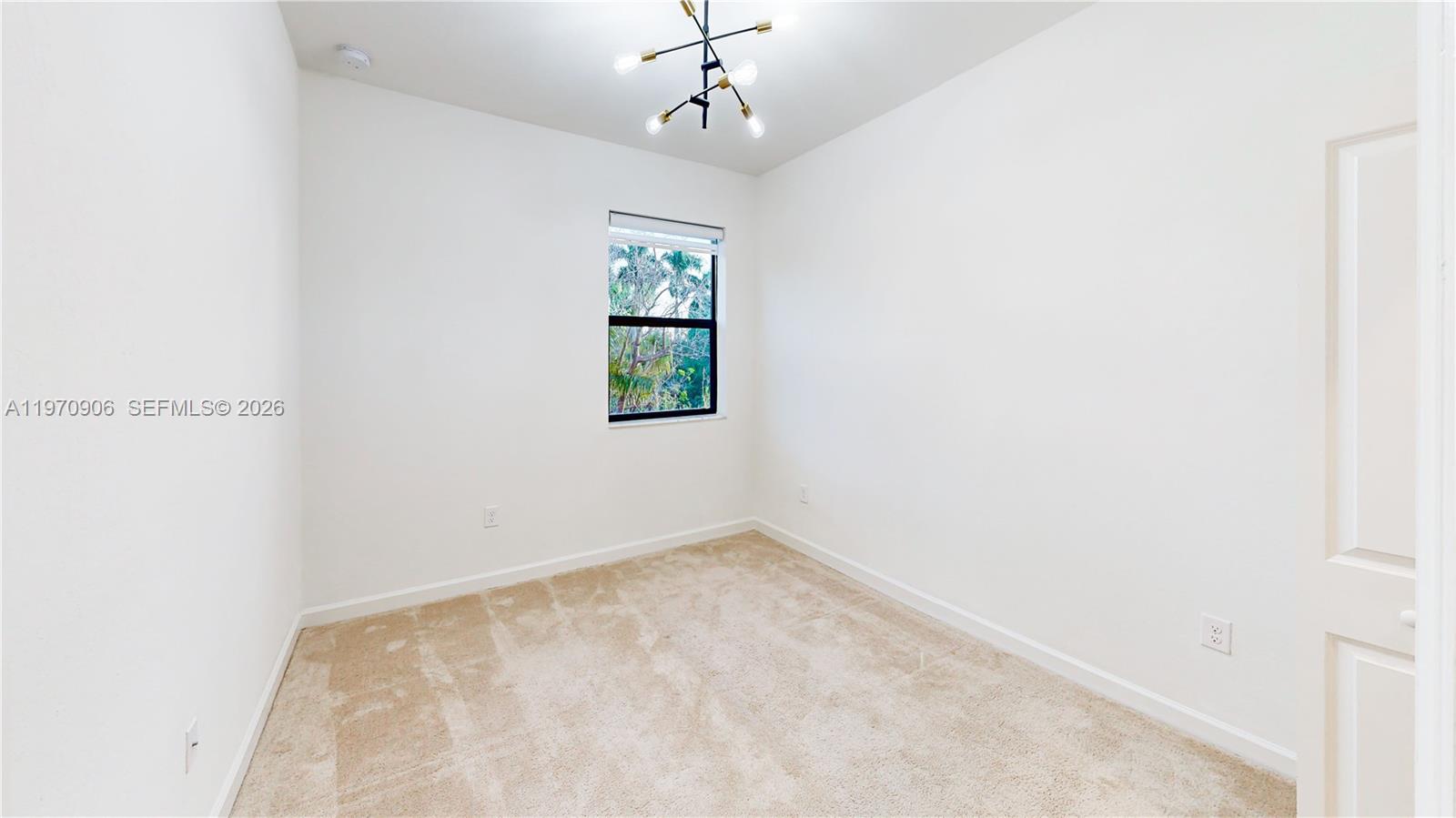 13158 Southwest 233rd Street Homestead, FL 33032 - Photo 28 of 72 an empty room with windows and closet