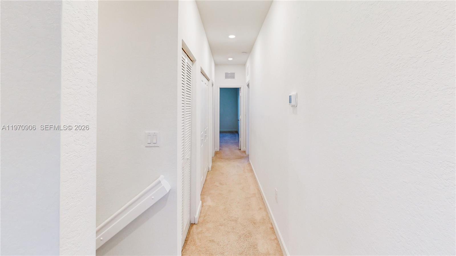 13158 Southwest 233rd Street Homestead, FL 33032 - Photo 30 of 72 a view of a hallway with white walls