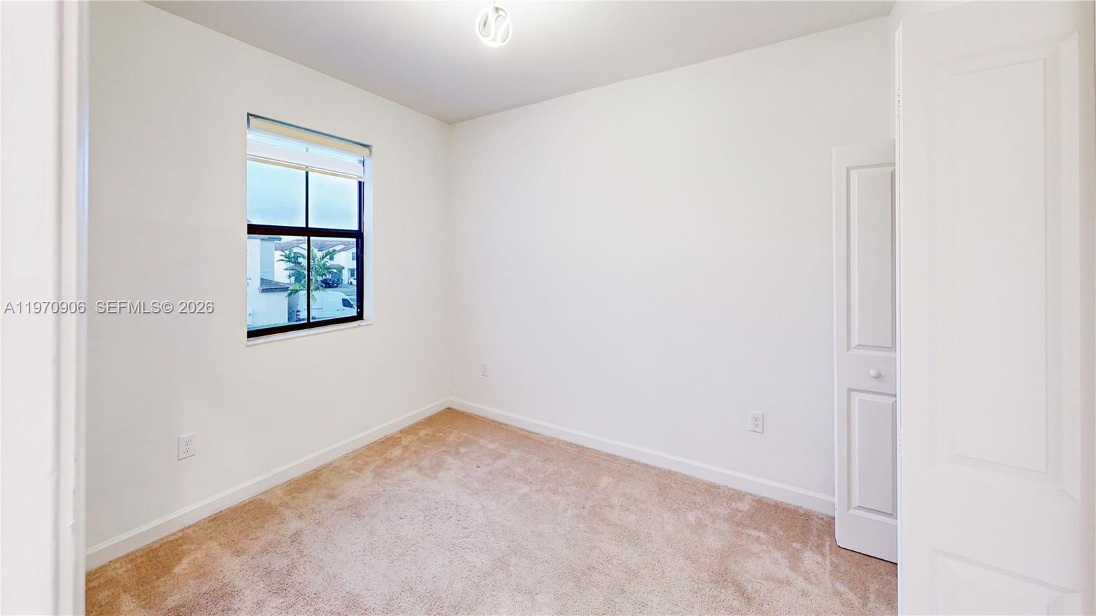 13158 Southwest 233rd Street Homestead, FL 33032 - Photo 32 of 72 an empty room with windows