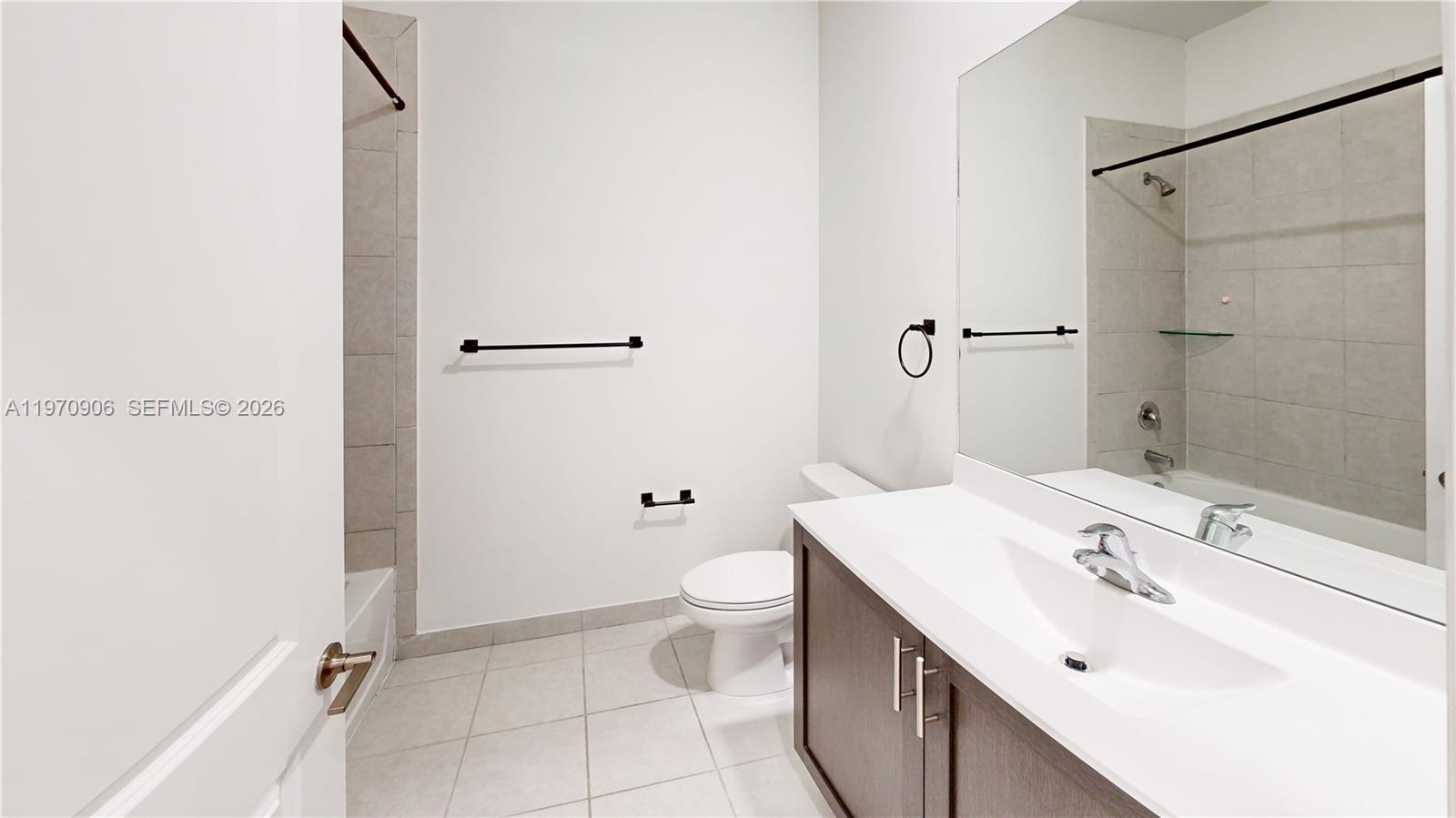 13158 Southwest 233rd Street Homestead, FL 33032 - Photo 34 of 72 a bathroom with a sink a toilet and shower