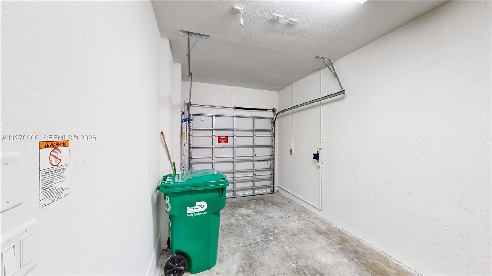 13158 Southwest 233rd Street Homestead, FL 33032 - Photo 41 of 72 a view of a hallway with storage and utility