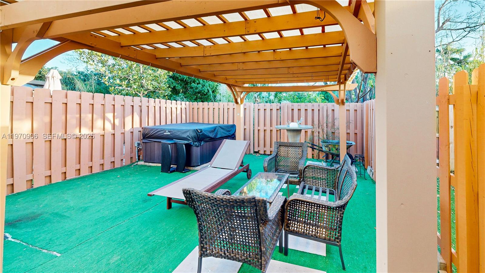 13158 Southwest 233rd Street Homestead, FL 33032 - Photo 43 of 72 a backyard of a house with barbeque oven table and chairs